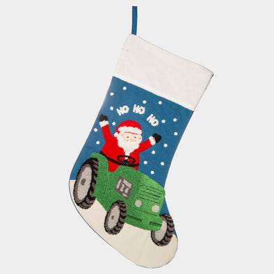 Père Noël dans une chaussette de Noël de tracteur